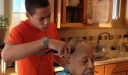 Zach giving Grandpa Moragne a haircut